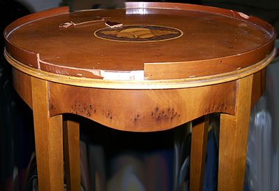 The edge banding of this table was severely damaged.