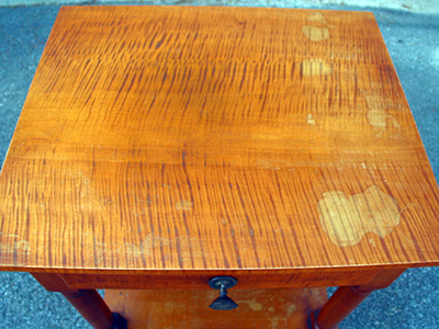 Significant moisture damage destroyed the top finish. Significant moisture damage destroyed the top finish.